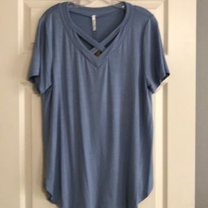 New. Women’s cross v-neck top.